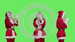 Cheerful saint nick clapping hands