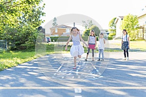 Cheerful school age child play on playground school