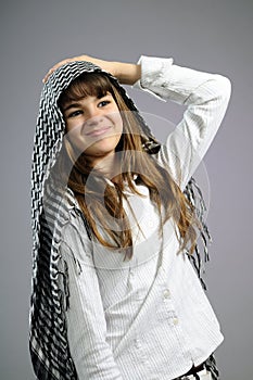 Cheerful school girl smiling in studio