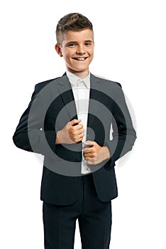 Cheerful schoolboy corrects jacket