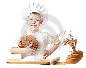 Cheerful scullion boy with a loaf of rye bread