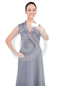 Cheerful seductive woman holding business card