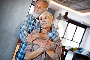 Cheerful senior couple enjoying life and spending time together