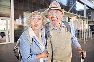 Cheerful senior couple having a good time outside