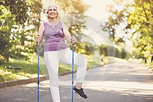 Cheerful senior woman doing a physical exercise