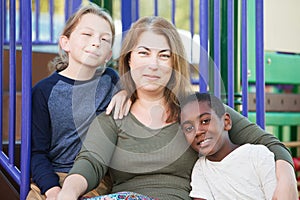 Cheerful single mom with sons outside photo