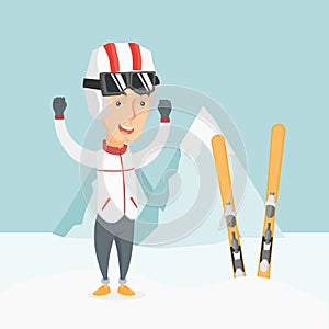 Cheerful skier standing with raised hands.