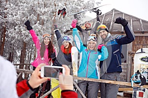 Cheerful of skiers on winter holiday, group photo