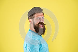 Cheerful smile. Man bearded hipster with mustache. Beard mustache grooming guide. Hipster handsome bearded guy yellow