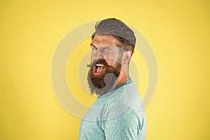 Cheerful smile. Man bearded hipster with mustache. Beard mustache grooming guide. Hipster handsome bearded guy yellow