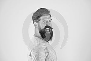 Cheerful smile. Man bearded hipster with mustache. Beard mustache grooming guide. Hipster handsome bearded guy yellow