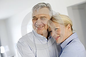 Cheerful smiling couple at home