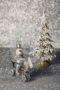 Cheerful snowman in the winter forest.