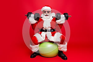 Cheerful sporty muscular virile strong Santa in white fluffy glo