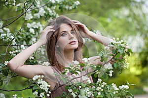 Cheerful spring woman enjoying nature outdoor, fashion beauty portrait