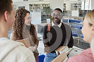 Cheerful Students Talking in College Library