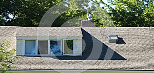 Cheerful Suburban Attic Dormer in Bright Sunlight