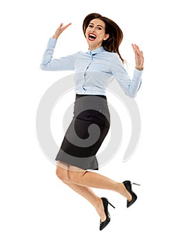 Happy businesswoman jumping for joy