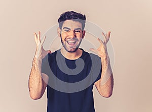 Cheerful surprised and happy man celebrating victory and wining lottery