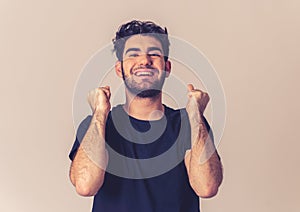 Cheerful surprised and happy man celebrating victory and wining lottery photo