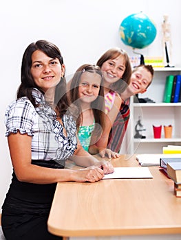 Cheerful teacher and several students