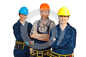 Cheerful team of three constructor workers