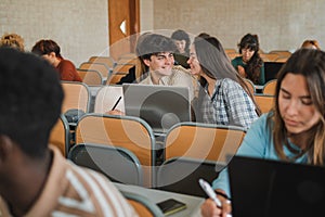 Cheerful teen couple during lesson