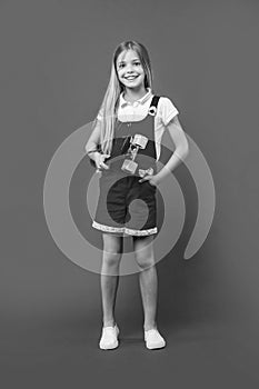 cheerful teen girl skateboarder on background. photo of teen girl skateboarder. photo