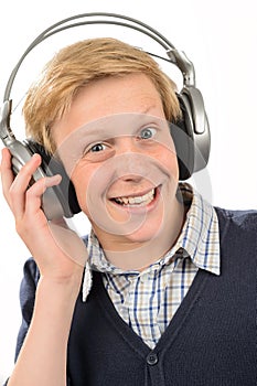 Cheerful teenage boy listening to music