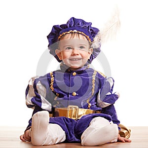 Cheerful toddler in a carnival suit