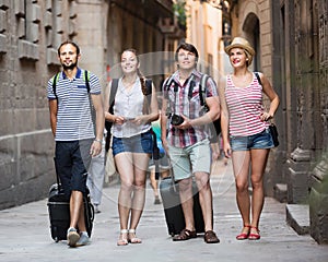 Cheerful tourists walking the street