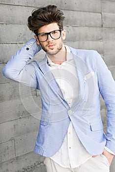 Cheerful trendy guy with black eyeglasses on