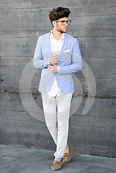 Cheerful trendy guy with black eyeglasses on