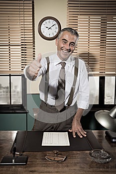 Cheerful vintage businessman thumbs up