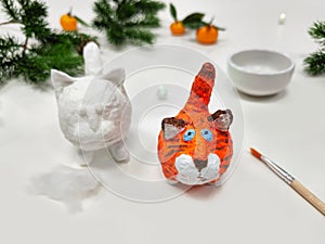 Cheerful wadding toy cats by handmade. Funny red and white cats