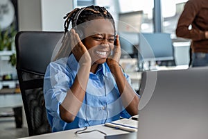 Cheerful woman call center operator having break during her work