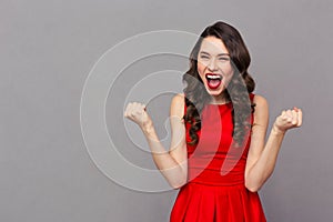 Cheerful woman celebrating her success