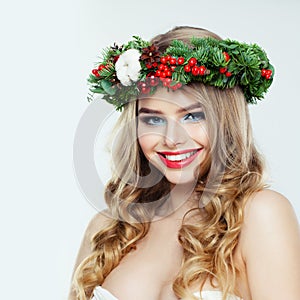 Cheerful woman with Christmas garland smiling on white background