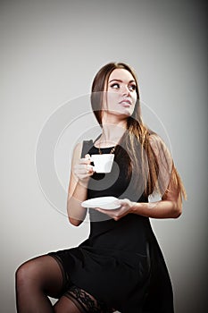 Cheerful woman drinking coffee