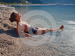 Cheerful woman enjoying the beach