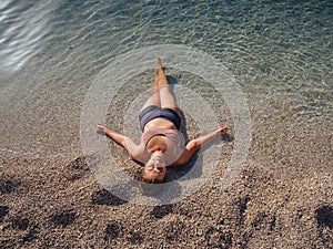 Cheerful woman enjoying the beach