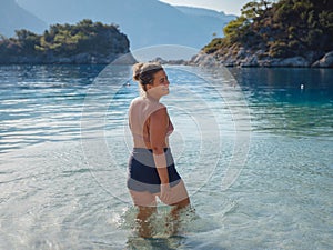 Cheerful woman enjoying the beach