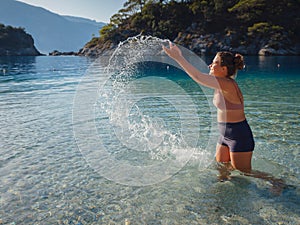 Cheerful woman enjoying the beach