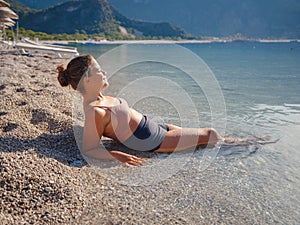 Cheerful woman enjoying the beach