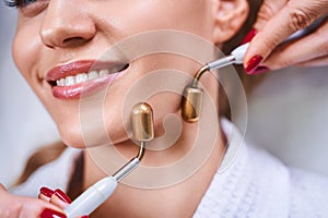 Cheerful woman enjoying beauty procedure stock photo