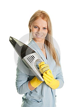 Cheerful woman with handheld vacuum cleaner photo