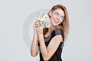 Cheerful woman holding money