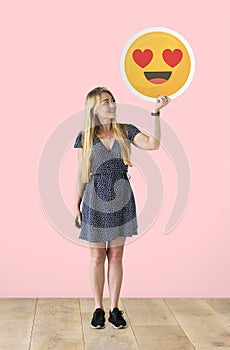 Cheerful woman holding speech bubble icon