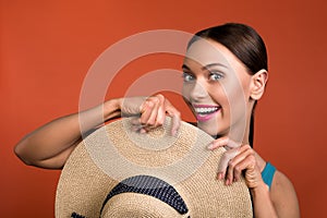 Cheerful woman holding summer accessory