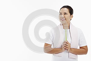 Cheerful woman holding up a tooth brush